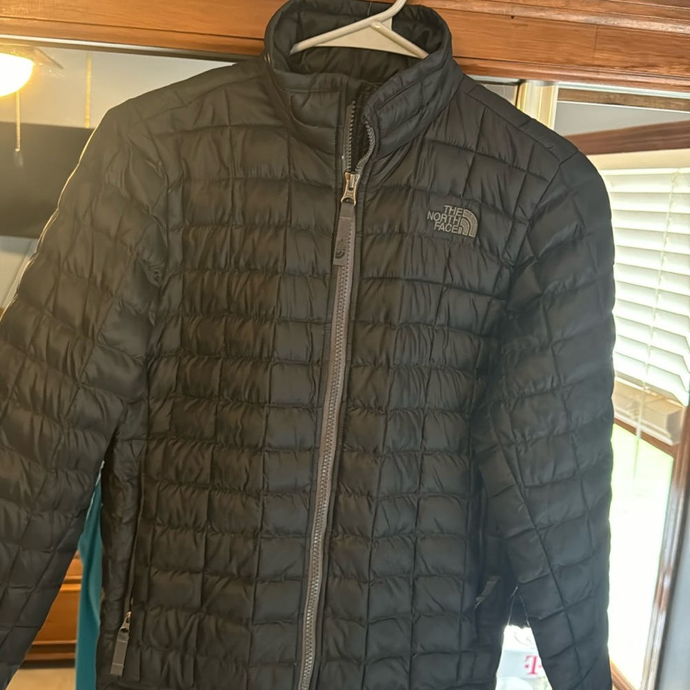 Boys north face thermal ball coat with small tear on sleeve